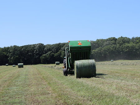 John Deere 567 hay baler baling hay in minnesota
