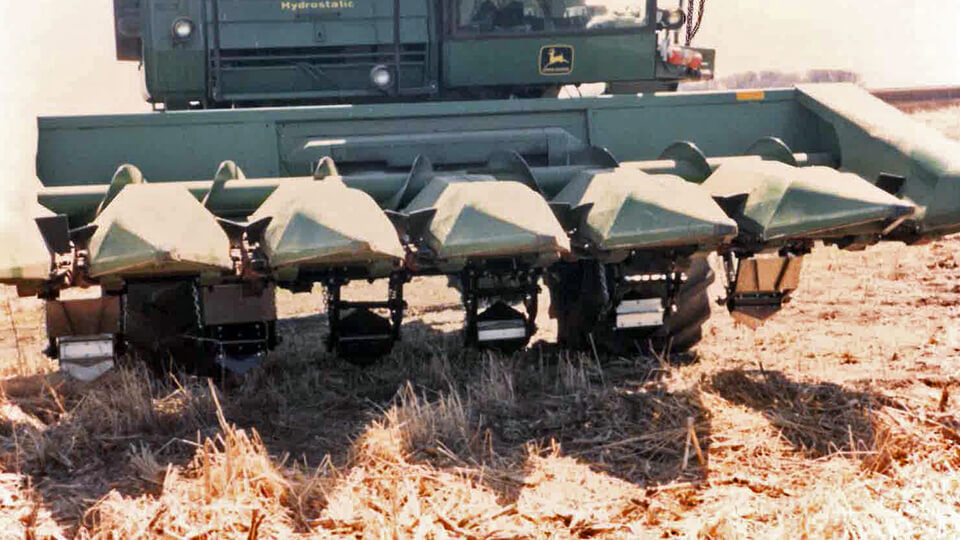 John Deere corn head with May Wes Manufacturing Original Stalk Stompers