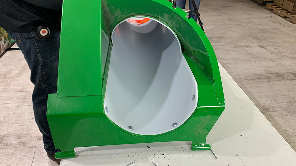 White poly tank fill tube liner installed in John Deere combine tank fill tube 