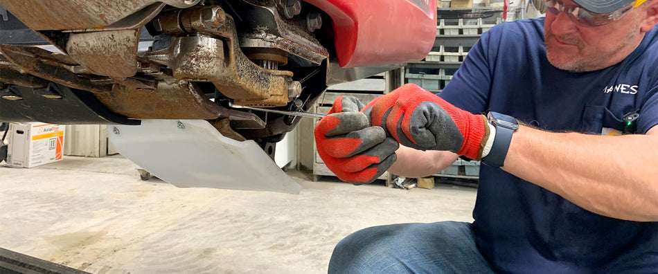 Eric from May Wes replacing a poly skid shoe on Case IH grain head at Welker Farms