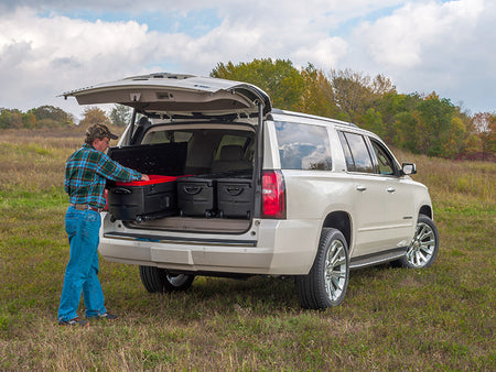 SUV with Du-Ha storage totes in the back