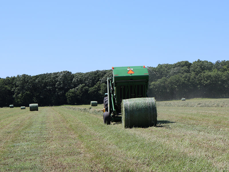 John Deere 567 hay baler baling hay in minnesota