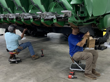 Larson Farms installing row divider shields