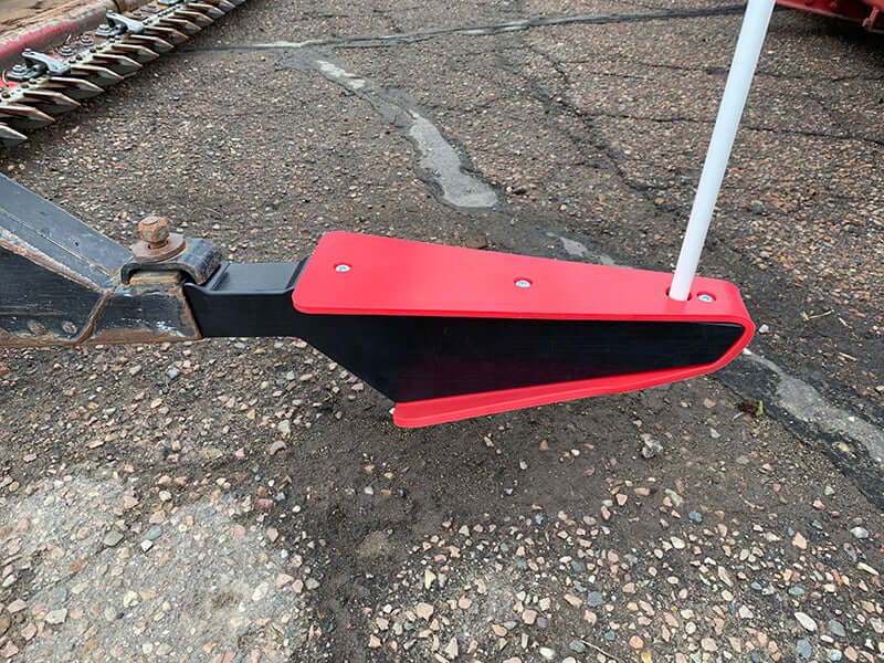 Red crop divider installed on Case IH grain head