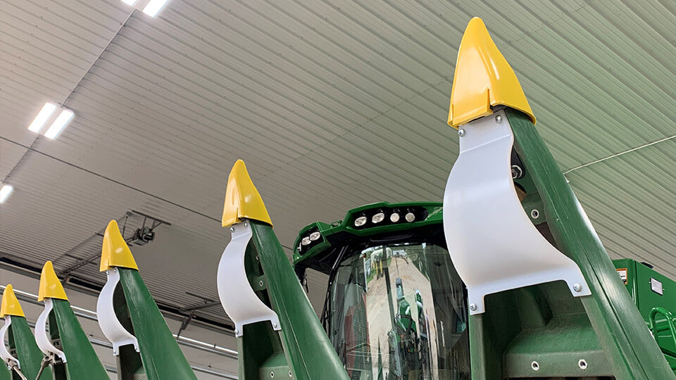 Load video: White poly Snout Savers and yellow Snoot Boots from May Wes Manufacturing installed on John Deere corn snouts