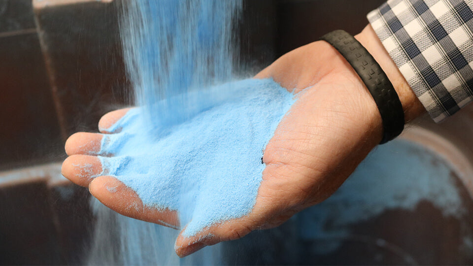 Load video: Pouring blue UHMW resin into hand